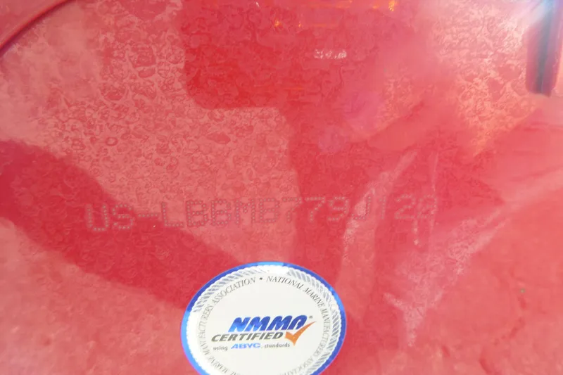 Slide: The Image of Close-up of a 2022 Lund 1650 Angler SS boat hull identification number and NMMA certification sticker. - 14