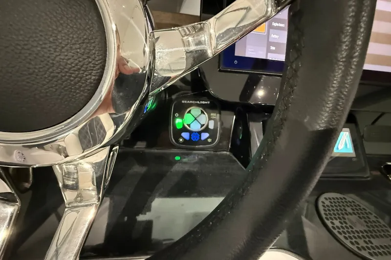 Slide: The Image of Steering wheel and control panel of 2025 Monterey Elite 27 OB boat. - 28
