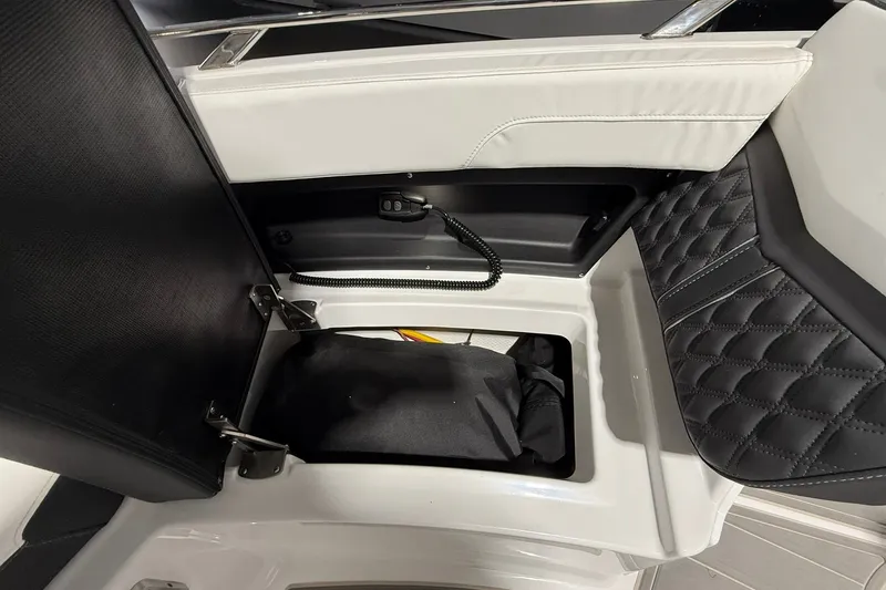 Slide: The Image of Storage compartment in 2025 Monterey Elite 27 OB boat with quilted upholstery. - 37