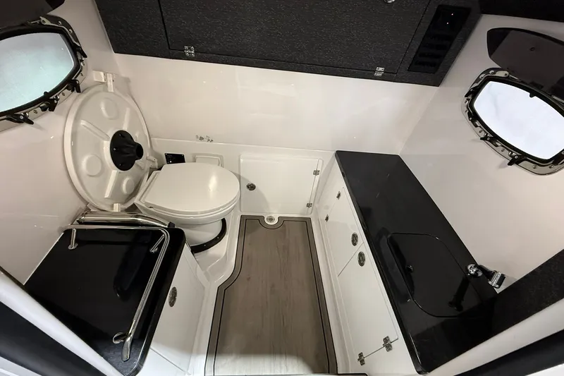 Slide: The Image of Luxurious bathroom interior of 2025 Monterey Elite 27 OB boat, featuring modern fixtures and sleek design. - 39