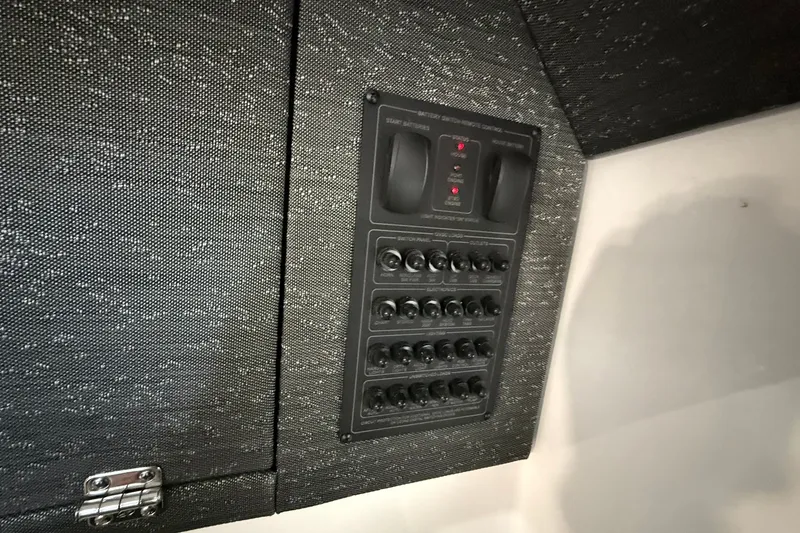 Slide: The Image of Control panel on 2025 Monterey Elite 27 OB boat interior. - 42