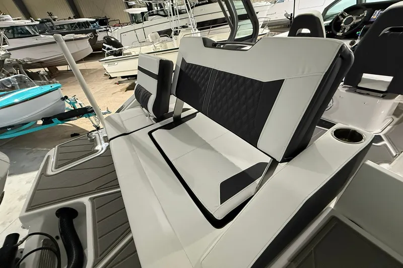 Slide: The Image of 2025 Monterey Elite 27 OB boat interior with sleek seating and modern design. - 15
