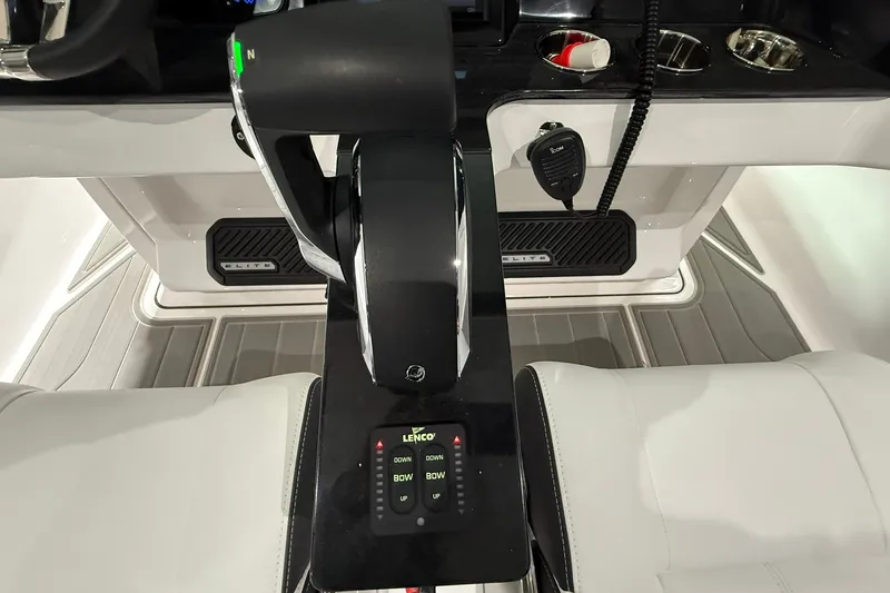 Slide: The Image of 2025 Monterey Elite 27 OB boat cockpit with controls and seating. - 21