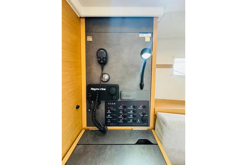 Slide: The Image of 2024 Jeanneau Sun Odyssey 349 control panel with Raymarine equipment and lighting. - 48