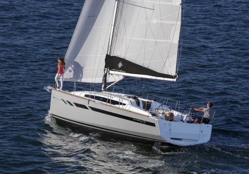 Slide: The Image of 2024 Jeanneau Sun Odyssey 349 sailing on open water. - 9