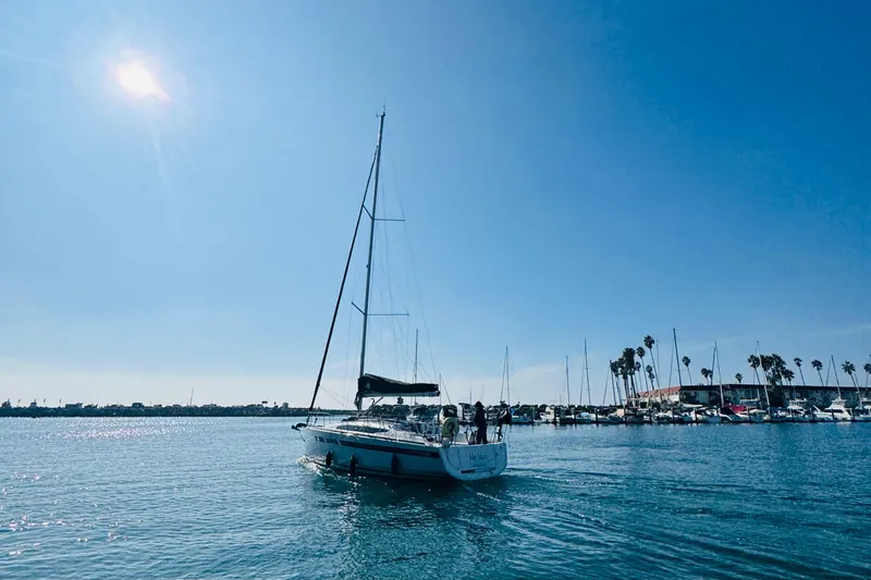 Slide: The Image of 2024 Jeanneau Sun Odyssey 349 sailing in sunny marina with clear blue sky. - 1