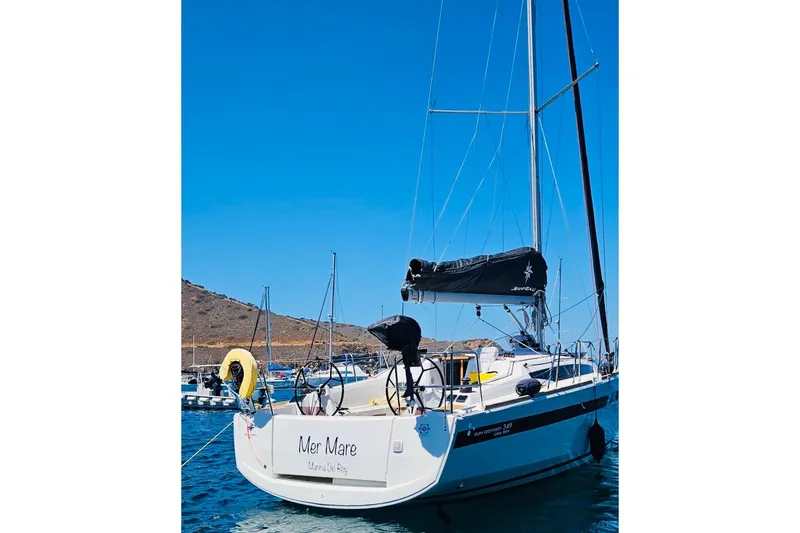 Slide: The Image of 2024 Jeanneau Sun Odyssey 349 sailboat docked in a sunny marina. - 6