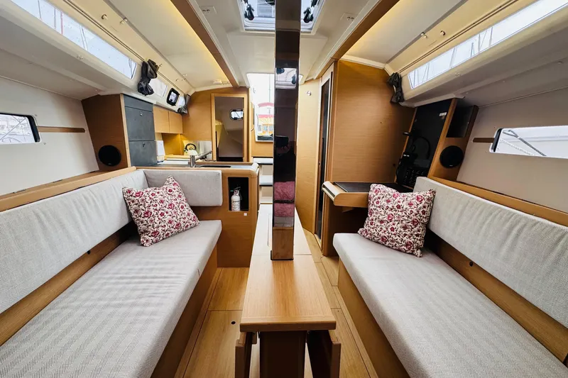 Slide: The Image of Interior of 2024 Jeanneau Sun Odyssey 349 sailboat, featuring cozy seating and modern design. - 51