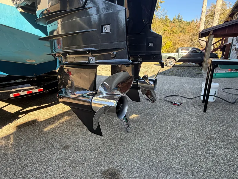 Slide: The Image of Close-up of two shiny propellers on a boat resting on a trailer. - 11