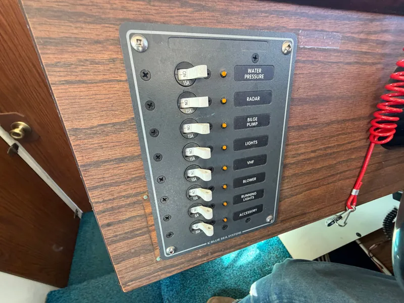 Slide: The Image of Control panel of a 1974 Fiberform Sportfisher 31 with various switches and indicators. - 41