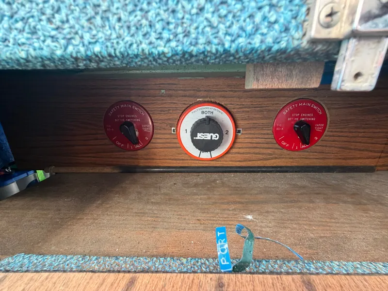 Slide: The Image of The image shows a wooden panel with three switches and carpeted flooring. - 39