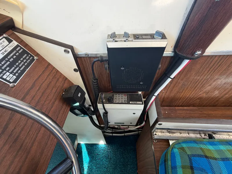 Slide: The Image of Interior view of a boat with radio equipment and wood paneling. - 33