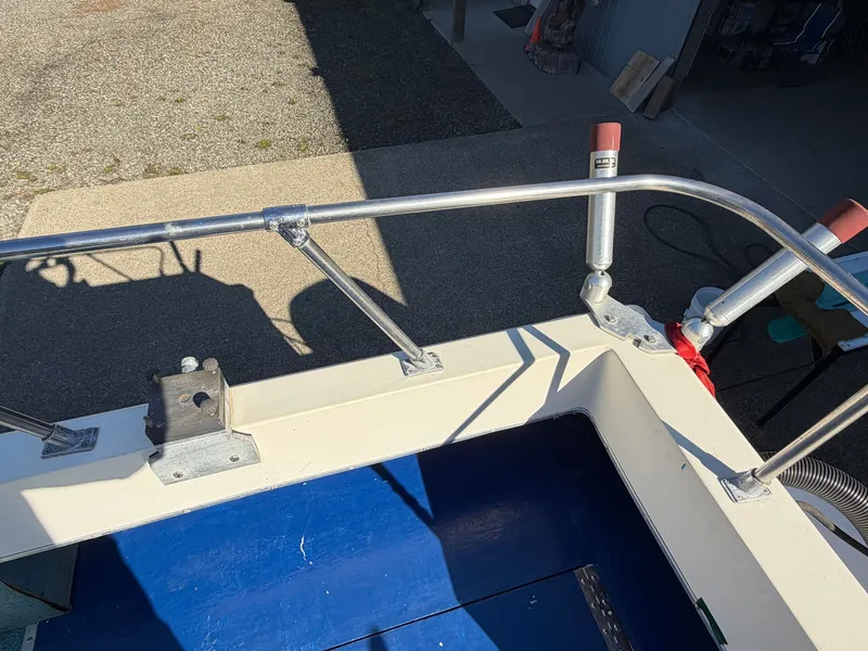 Slide: The Image of The image shows the deck of a 1974 Fiberform Sportfisher 31 with a blue floor area. - 13