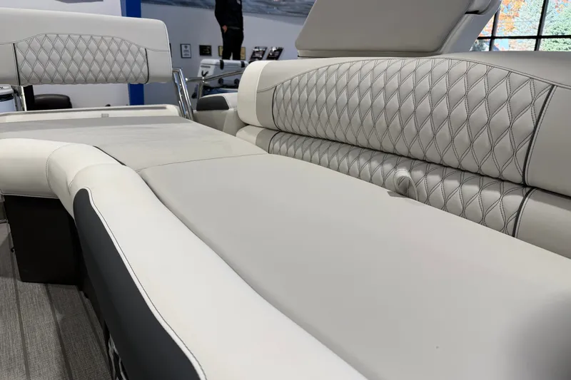 Slide: The Image of Luxurious seating on 2027 Avalon 2585 EXCALIBUR QLWS boat, featuring elegant diamond stitching. - 14