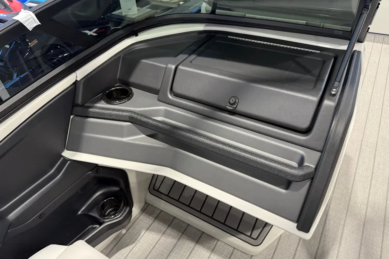 Slide: The Image of Interior of 2027 Avalon 2585 EXCALIBUR QLWS boat with cup holders and storage compartment. - 10
