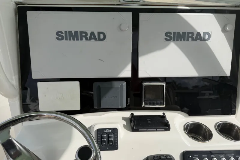 Slide: The Image of Dashboard of 2022 NauticStar 28 XS boat with Simrad displays and controls. - 56