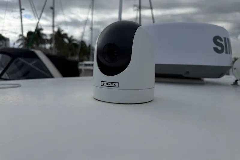 Slide: The Image of SIONYX camera on 2022 NauticStar 28 XS boat deck, with marina background. - 27