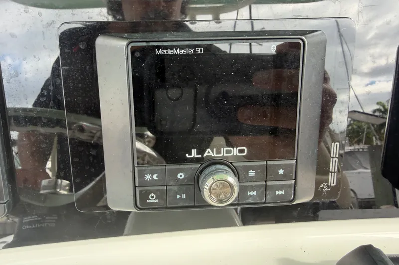 Slide: The Image of JL Audio MediaMaster 50 control panel on 2022 NauticStar 28 XS boat. - 44