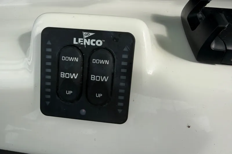 Slide: The Image of Lenco trim tab control panel on 2022 NauticStar 28 XS boat. - 37