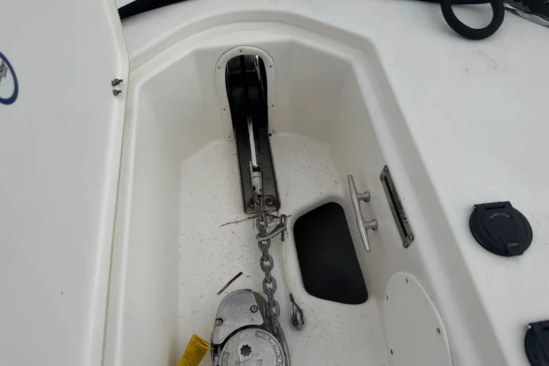 Slide: The Image of 2022 NauticStar 28 XS anchor locker with chain and cleat details. - 22