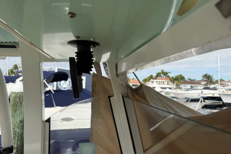 Slide: The Image of Interior view of a 2022 NauticStar 28 XS boat with marina background. - 7
