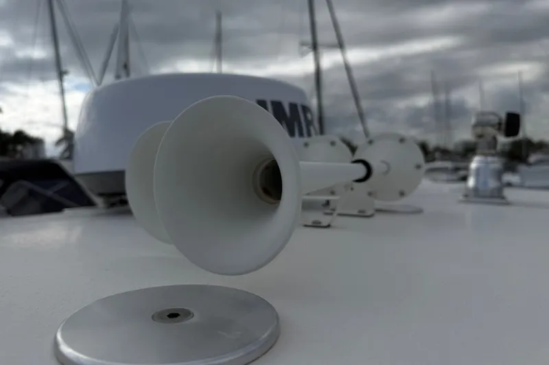 Slide: The Image of Close-up of a 2022 NauticStar 28 XS boat horn on a cloudy day. - 28