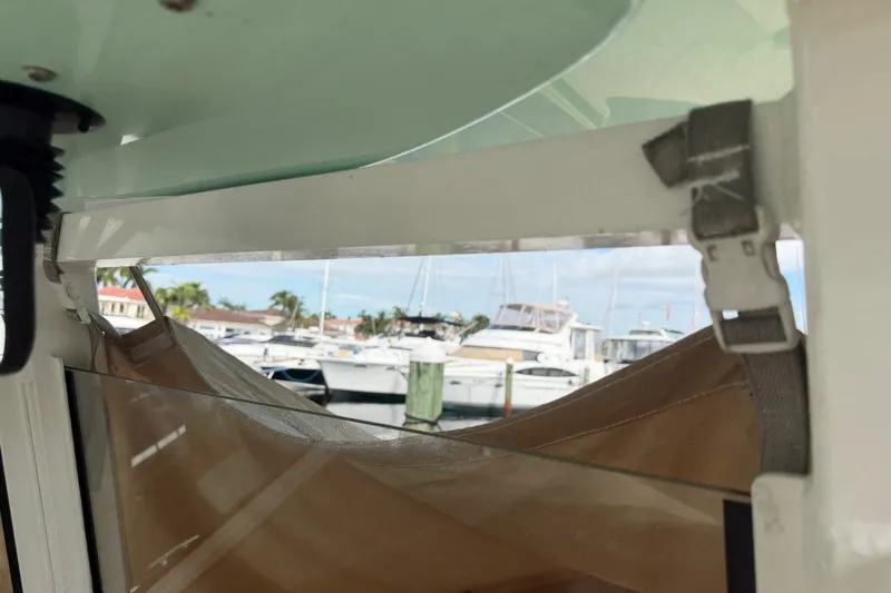 Slide: The Image of Interior view of 2022 NauticStar 28 XS boat with marina background. - 6
