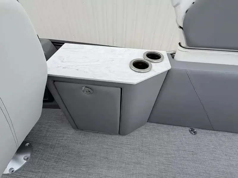Slide: The Image of The boat interior features a gray seat with a white table and cup holders. - 14