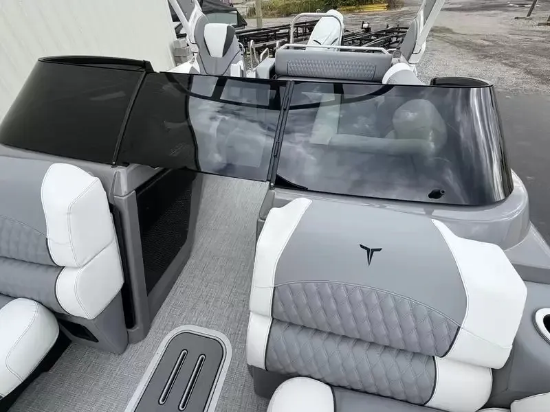 Slide: The Image of The image shows the cockpit of a modern boat with gray and white seating. - 16