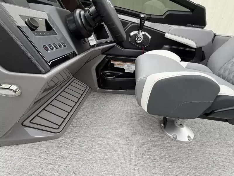 Slide: The Image of The image shows a modern boat cockpit with gray seating and a sleek dashboard. - 5