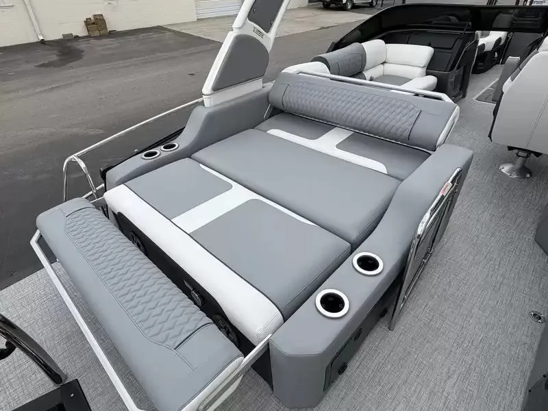 Slide: The Image of The image shows the luxurious lounge deck of a 2027 Tahoe Grand 25 Flex Lounge Windshield boat. - 3