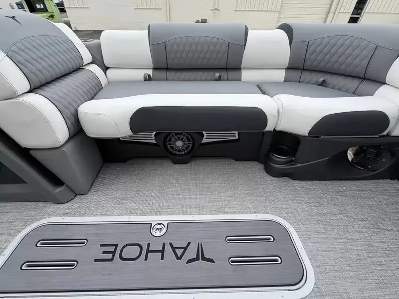 Slide: The Image of Interior view of a modern boat with gray and white upholstery and a speaker. - 19