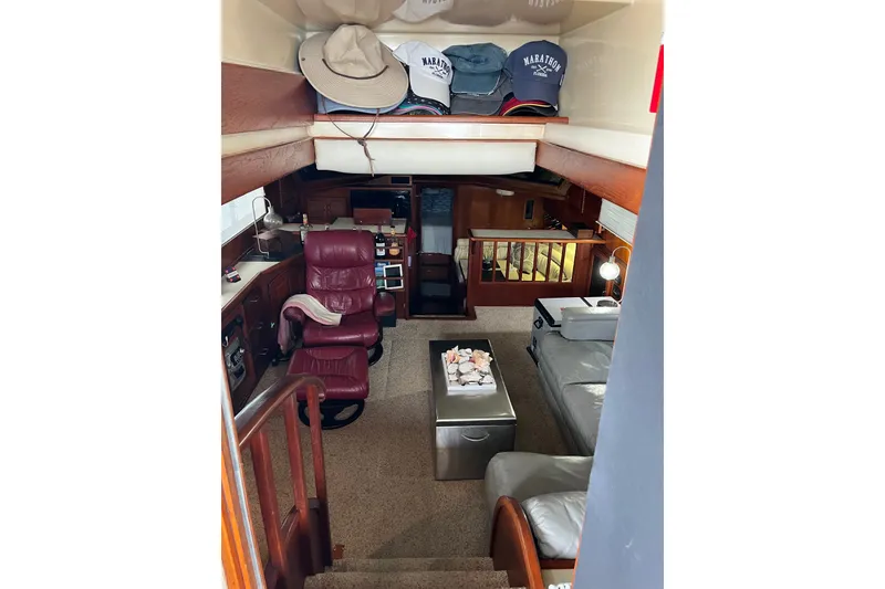 Slide: The Image of Interior of 1989 Californian 45 Motor Yacht with leather seating and nautical decor. - 15