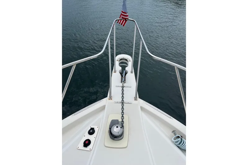 Slide: The Image of Bow of 1989 Californian 45 Motor Yacht with anchor chain and American flag. - 7