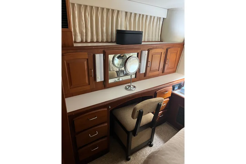 Slide: The Image of 1989 Californian 45 Motor Yacht interior with wooden cabinetry and vanity area. - 35