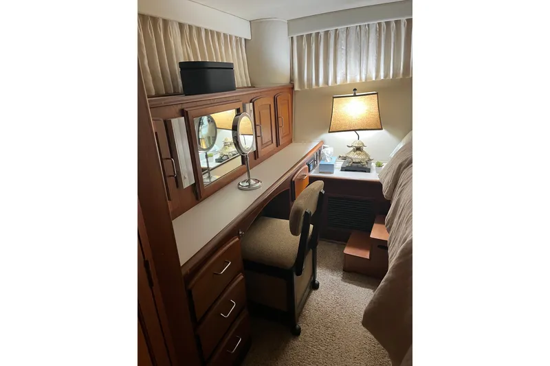 Slide: The Image of Interior of 1989 Californian 45 Motor Yacht with vanity, mirror, and lamp. - 36