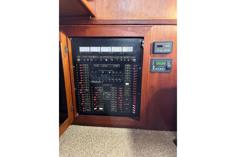 Slide: The Image of Electrical panel of a 1989 Californian 45 Motor Yacht with control switches and meters. - 19