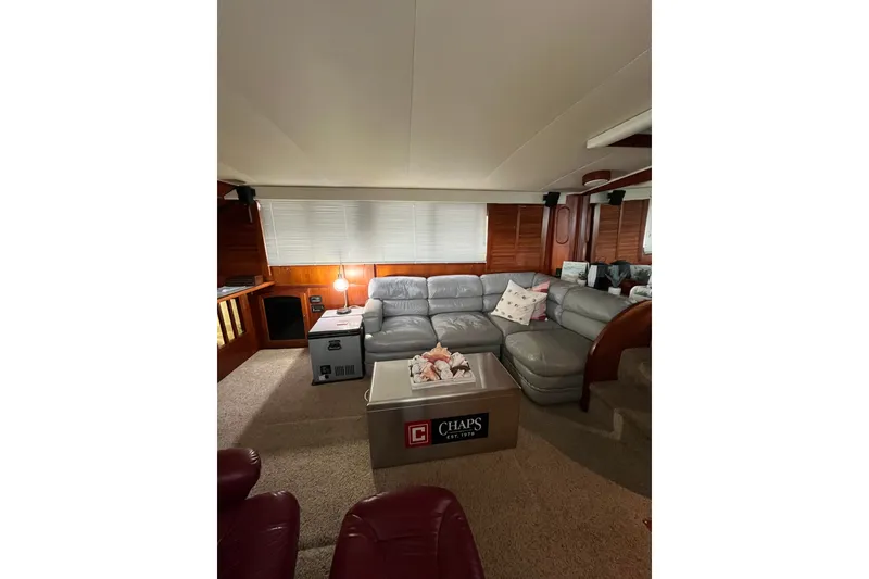 Slide: The Image of Luxurious interior of 1989 Californian 45 Motor Yacht with cozy seating and elegant decor. - 18