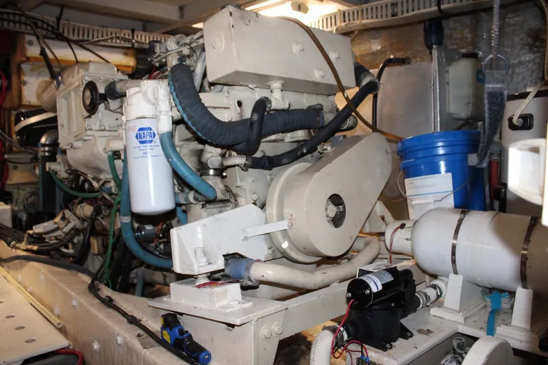 Slide: The Image of Engine room of a 1989 Californian 45 Motor Yacht with visible components and equipment. - 46