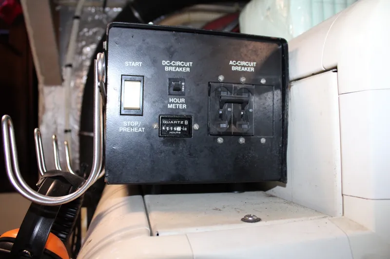 Slide: The Image of Control panel on a 1989 Californian 45 Motor Yacht with circuit breakers and hour meter. - 42
