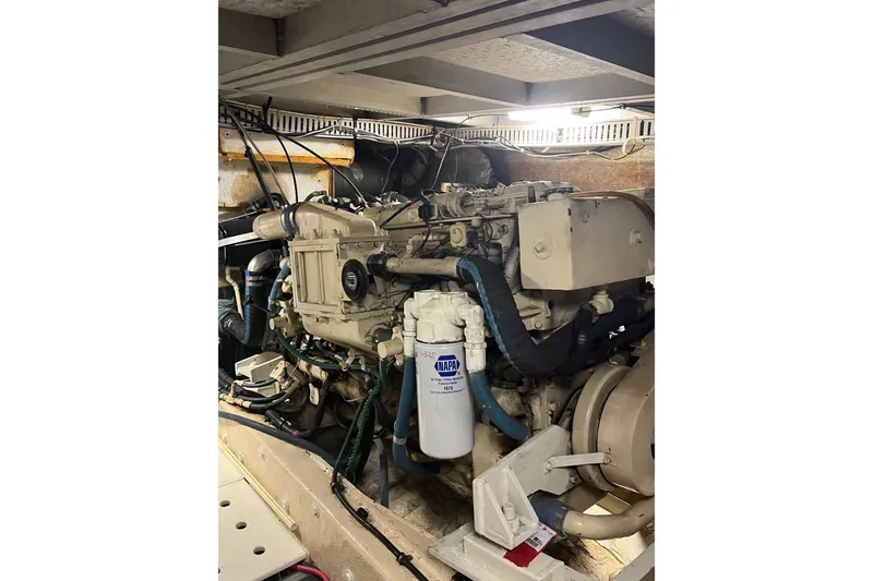Slide: The Image of Engine room of a 1989 Californian 45 Motor Yacht, showcasing mechanical components. - 45