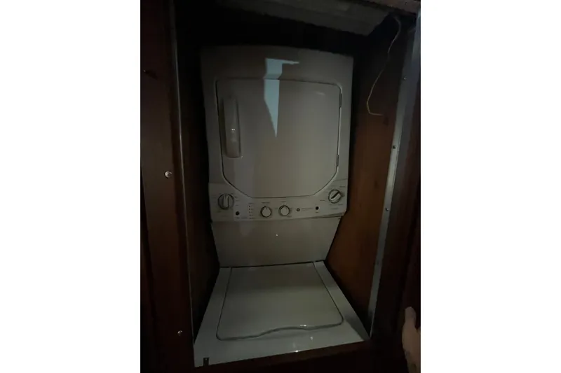 Slide: The Image of Stacked washer and dryer inside 1989 Californian 45 Motor Yacht. - 32