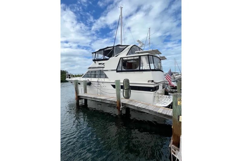 Slide: The Image of 1989 Californian 45 Motor Yacht docked at marina under blue sky. - 1