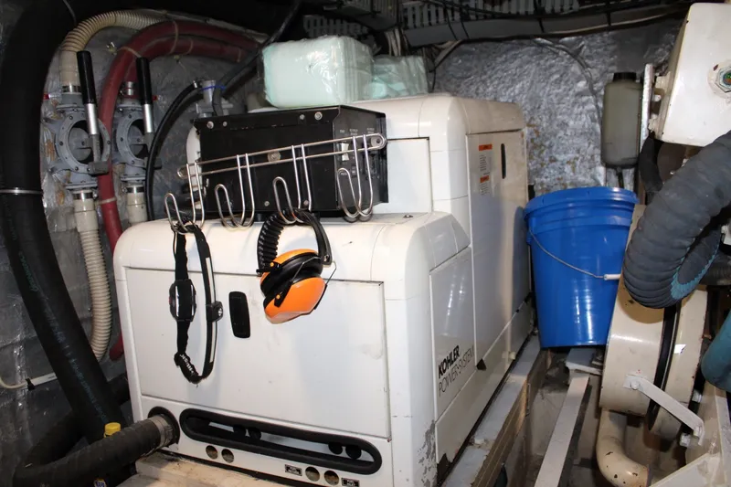 Slide: The Image of Engine room of 1989 Californian 45 Motor Yacht with Kohler generator and safety gear. - 41