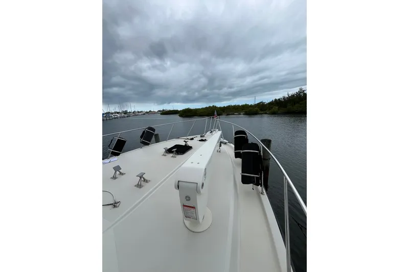 Slide: The Image of 1989 Californian 45 Motor Yacht on calm water under cloudy skies. - 9