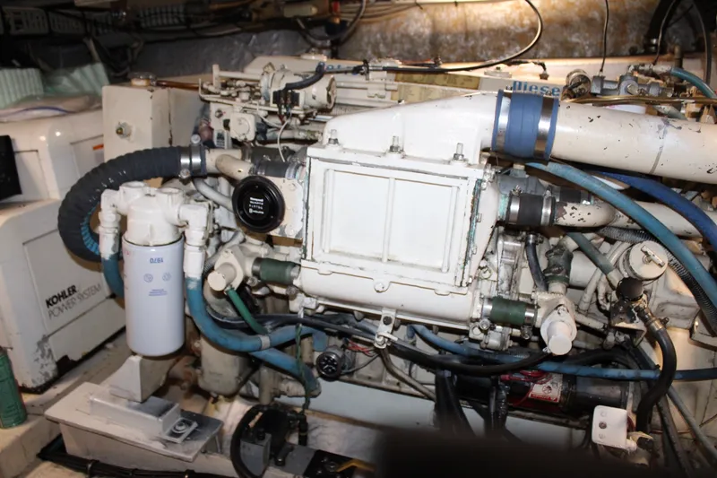 Slide: The Image of Engine room of a 1989 Californian 45 Motor Yacht with visible components and wiring. - 44