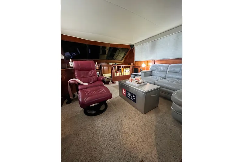 Slide: The Image of Interior of 1989 Californian 45 Motor Yacht with leather seating and cozy decor. - 16