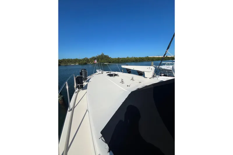 Slide: The Image of 1989 Californian 45 Motor Yacht on calm water under clear blue sky. - 5