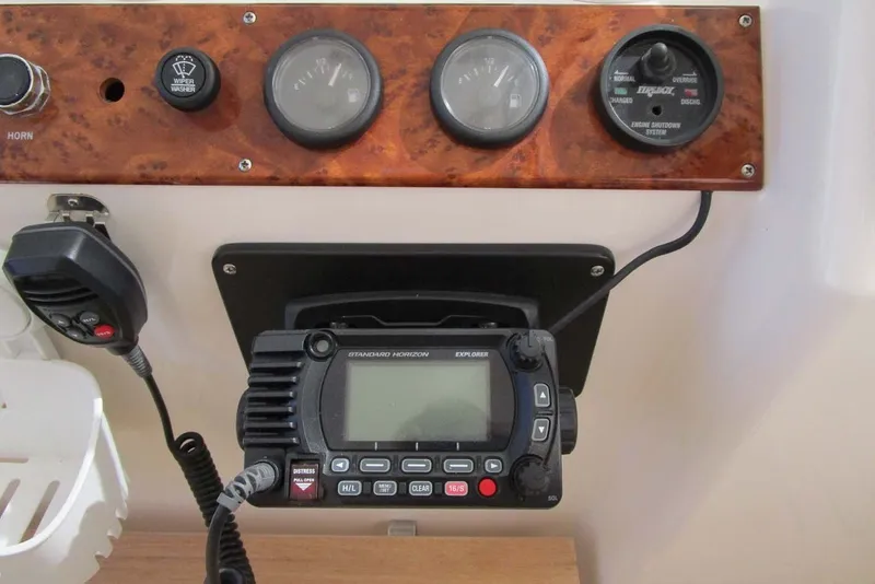 Slide: The Image of Control panel of a 2006 Neptunus 56 Flybridge with radio and gauges. - 60