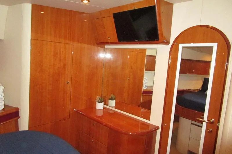 Slide: The Image of Luxurious 2006 Neptunus 56 Flybridge yacht interior with wood cabinetry and modern amenities. - 32